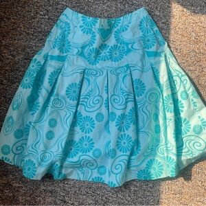 Dynamite Blue A-Line Skirt with white floral pattern and pleats